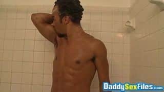 Ebony daddy strokes his dick and uses toys while showering